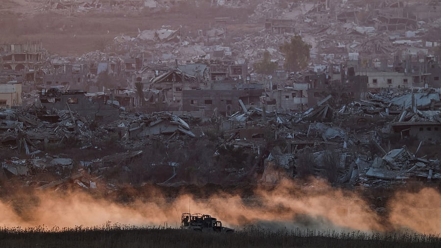 <div class="paragraphs"><p>An Israeli military vehicle manoeuvres in Gaza, as seen from the Israeli side of the Israel-Gaza border.</p></div>