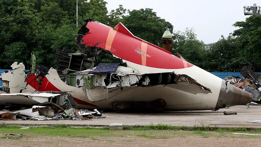 <div class="paragraphs"><p>Wreckage of the Air India Boeing 787-8 Dreamliner plane sits on the open ground, outside Sardar Vallabhbhai Patel International Airport</p></div>