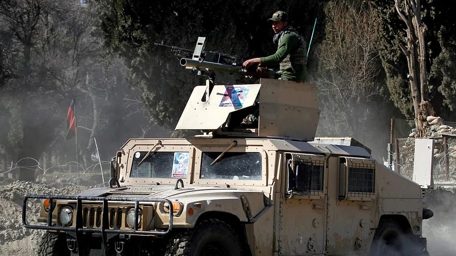 An armoured vehicle patrols near the side of an incident where two US soldiers were killed a day before in Shirzad district of Nangarhar province, Afghanistan. Credit: Reuters Photo