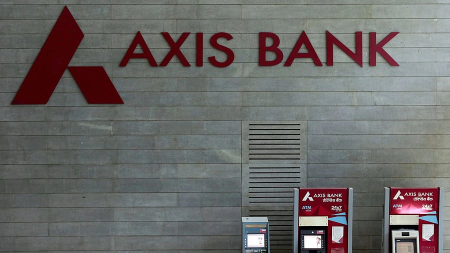 <div class="paragraphs"><p>Axis Bank's logo is seen next to ATM machines at its corporate headquarters in Mumbai, India </p></div>