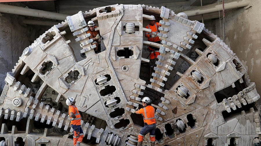 <div class="paragraphs"><p>Workers stand in front of a tunnel boring machine (TBM) during the breakthrough of a tunnel for the future tramway line in Nice, France.</p></div>