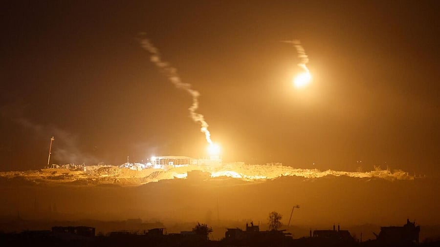 <div class="paragraphs"><p>Flares fired by Israel Defense Forces light the sky above Gaza, as seen from the Israeli side of the border.</p></div>