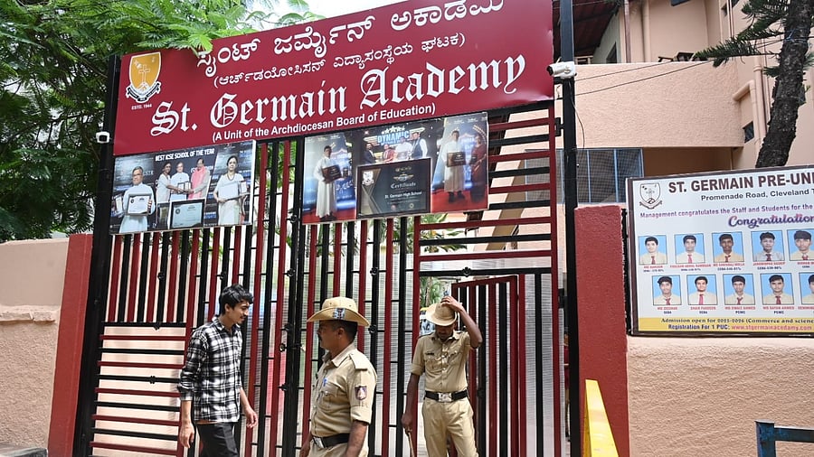 <div class="paragraphs"><p>Police search at the St Germain Academy at Cleveland Town in Bengaluru on Friday. </p></div>