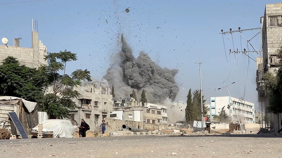 <div class="paragraphs"><p>A girl runs from the scene after Israeli strikes on a school sheltering displaced people at the Bureij refugee camp in the central Gaza Strip.</p></div>