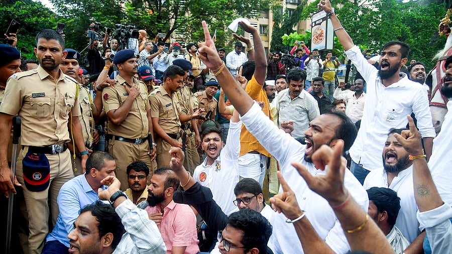 <div class="paragraphs"><p>Members of Maharashtra Navnirman Sena, a regionalist organisation, demonstrate to counter a protest staged earlier by traders after a food stall owner was slapped for not speaking Marathi. </p></div>