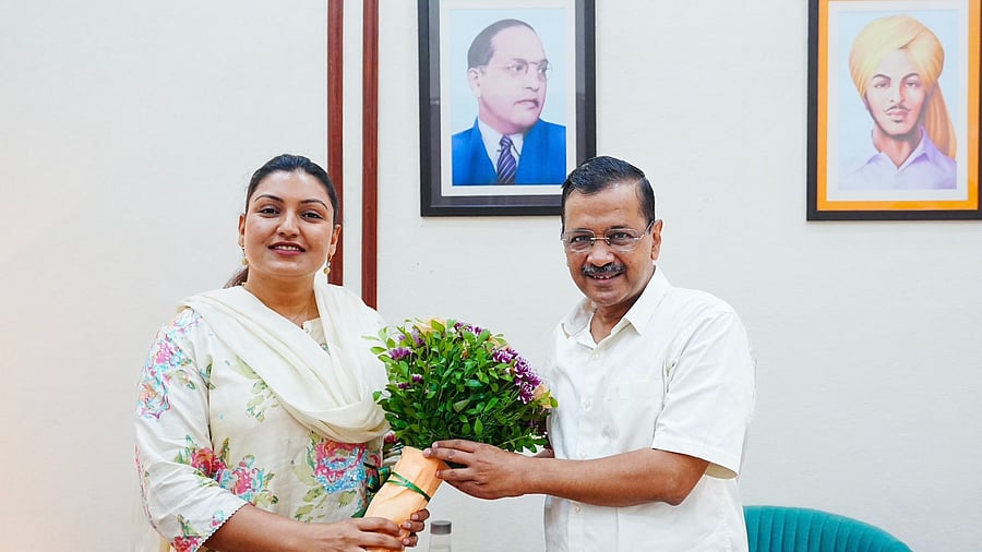 <div class="paragraphs"><p>Anmol Gagan Maan with Arvind Kejriwal.</p></div>