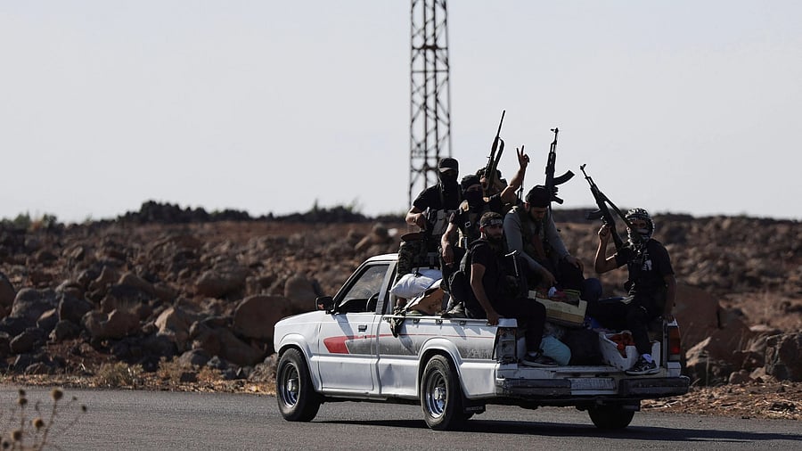 <div class="paragraphs"><p>Bedouin fighters ride a car, following renewed fighting between Bedouin fighters and Druze gunmen, despite an announced truce, in Sweida, Syria.</p></div>
