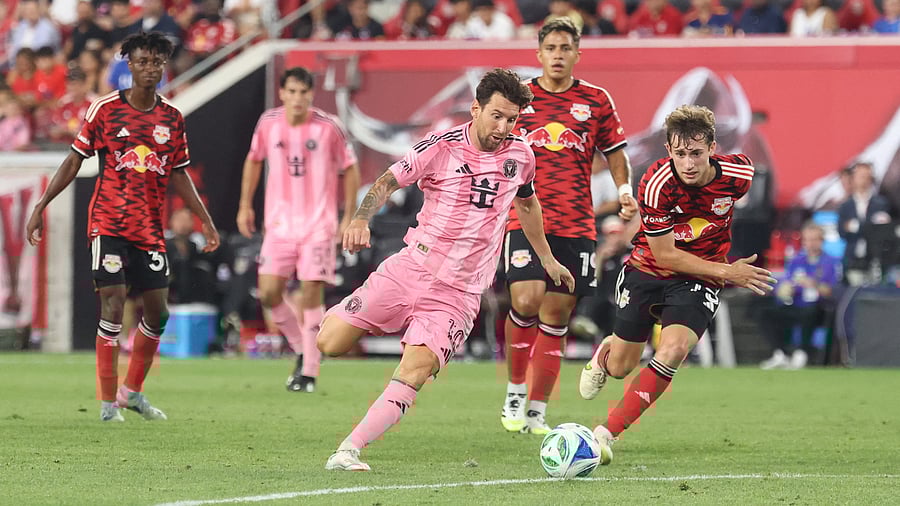 <div class="paragraphs"><p>Inter Miami CF forward Lionel Messi (10) kicks the ball in front of New York Red Bulls midfielder Daniel Edelman (75) during the second half at Sports Illustrated Stadium.</p></div>