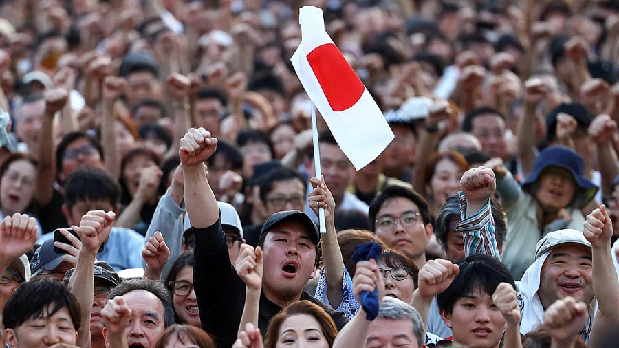 <div class="paragraphs"><p>Sanseito party supporters raise their fists during the Sanseito's election campaign tour, on the last day of campaigning for the July 20 upper house election, at Shiba Park in Tokyo, Japan.</p></div>
