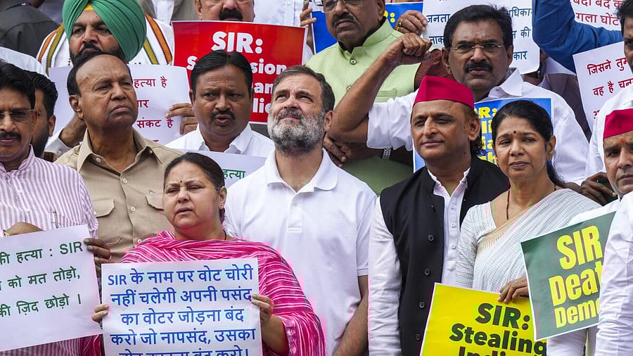 <div class="paragraphs"><p>LoP in the Lok Sabha and Congress leader Rahul Gandhi with Samajwadi Party MP Akhilesh Yadav, RJD MP Misa Bharti, DMK MP Kanimozhi Karunanidhi and other I.N.D.I.A. bloc MPs stages a protest against the ongoing Special Intensive Revision (SIR) in Bihar, during the Monsoon session of Parliament, in New Delhi on Tuesday.</p></div>