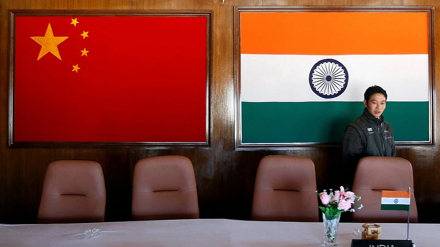 <div class="paragraphs"><p>A man walks inside a conference room used for meetings between military commanders of China and India, at the Indian side of the Indo-China border at Bumla, in the northeastern Indian state of Arunachal Pradesh.</p></div>