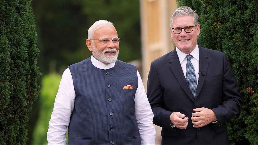<div class="paragraphs"><p>Britain's Prime Minister Keir Starmer and Prime Minister Narendra Modi of India walk on the ground at Chequers near Aylesbury, England.</p></div>