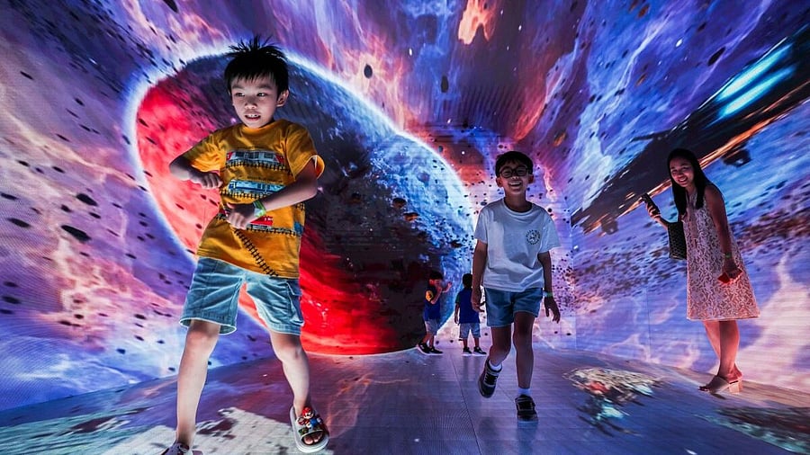 <div class="paragraphs"><p>Purawish Bunyagarn, 7 and other children attend "Space & Time Cube +", a cutting‑edge immersive art and metaverse-inspired experience, in Bangkok, Thailand.</p></div>