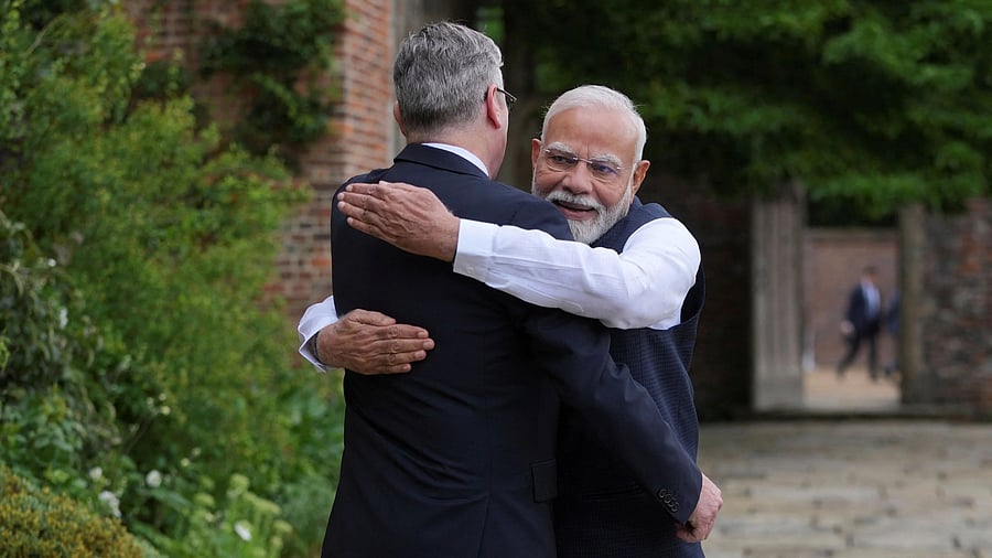 <div class="paragraphs"><p>Indian Prime Minister Narendra Modi hugs Britain's Prime Minister Keir Starmer as he arrives at Chequers near Aylesbury, England, Thursday, July 24, 2025.    </p></div>