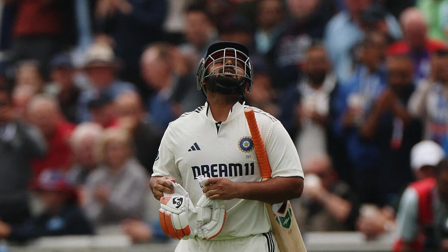 <div class="paragraphs"><p>Rishabh Pant comes out to continue his innings after retiring due to an injured foot during yesterday.</p></div>