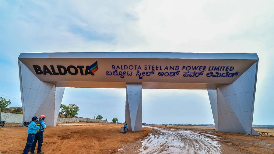 <div class="paragraphs"><p>Security personnel guard outside the proposed Baldota steel plant on the outskirts of Koppal city.</p></div>