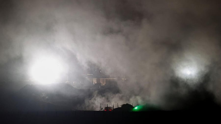 <div class="paragraphs"><p>Israeli military vehicles manoeuvre in Gaza, as seen from the Israeli side of the Israel-Gaza border</p></div>