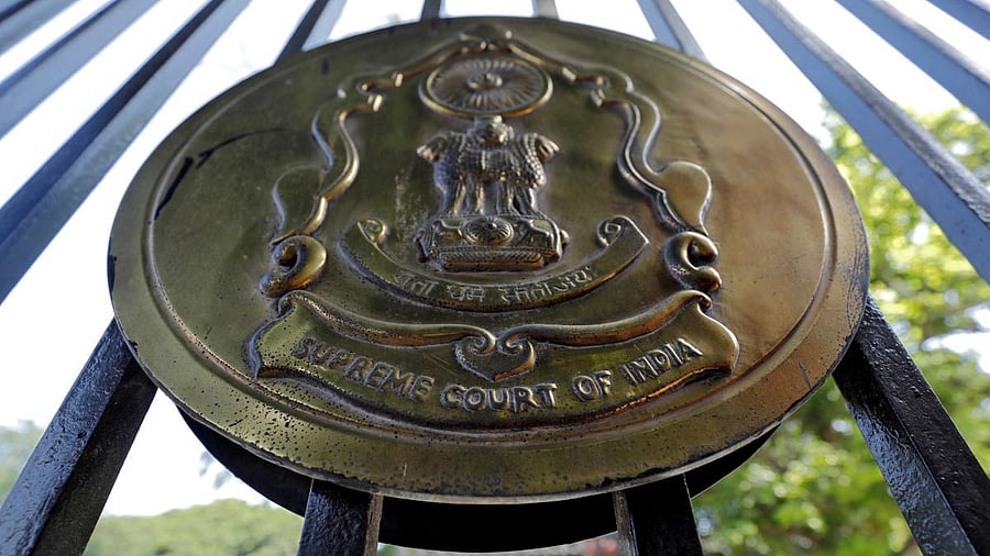 <div class="paragraphs"><p>The emblem of the Supreme Court is seen on the gate of the apex court. </p></div>