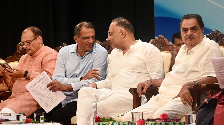 <div class="paragraphs"><p>District in-Charge Minister Dinesh Gundu Rao and MLC Manjunath Bhandari share a lighter moment during  a consultation meeting with the management members of temples under the Hindu Religious Institutions and Charitable Endowments Department at Town Hall in Mangaluru.  </p></div>