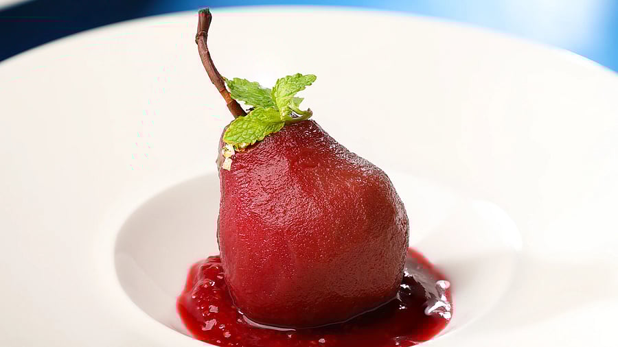 Chocolate Infused Poached Pears With Vanilla Quenelle. 