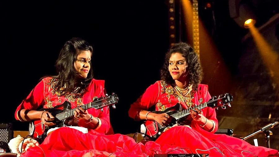 <div class="paragraphs"><p>Sreeusha and (left) Sireesha play a modified mandolin with five strings. </p></div>