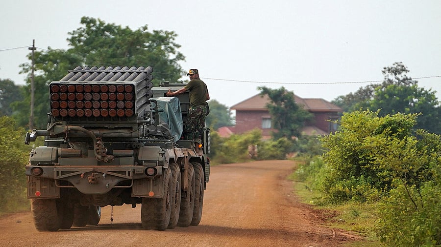 <div class="paragraphs"><p>A Cambodian military personnel stands on a BM-21 Grad multiple rocket launcher, around 40 km (24 miles) from the disputed Ta Moan Thom temple, after Thailand and Cambodia exchanged heavy artillery on Friday as their worst fighting in more than a decade, July 25, 2025.</p></div>