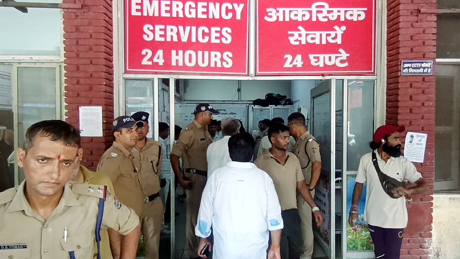<div class="paragraphs"><p>Police personnel keep vigil at a hospital where injured people are being treated after a stampede broke out at Mansa Devi temple, in Haridwar, Uttarakhand, Sunday, July 27, 2025.</p></div>