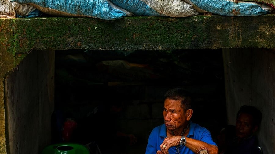 <div class="paragraphs"><p>A man looks on inside a bunker in Sisaket province, as Cambodia and Thailand each said the other had launched artillery attacks across contested border areas early on Sunday, hours after US President Donald Trump said the leaders of both countries had agreed to work on a ceasefire</p></div>