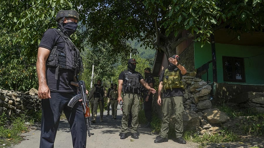 <div class="paragraphs"><p>Security personnel keep vigil after at least three unidentified terrorists were killed in an encounter, near Dachigam.</p></div>