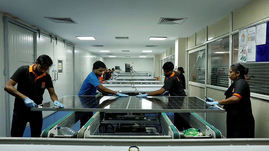 <div class="paragraphs"><p>Technicians work on the assembly line in a solar manufacturing hub in Greater Noida, on the outskirts of New Delhi India</p></div>