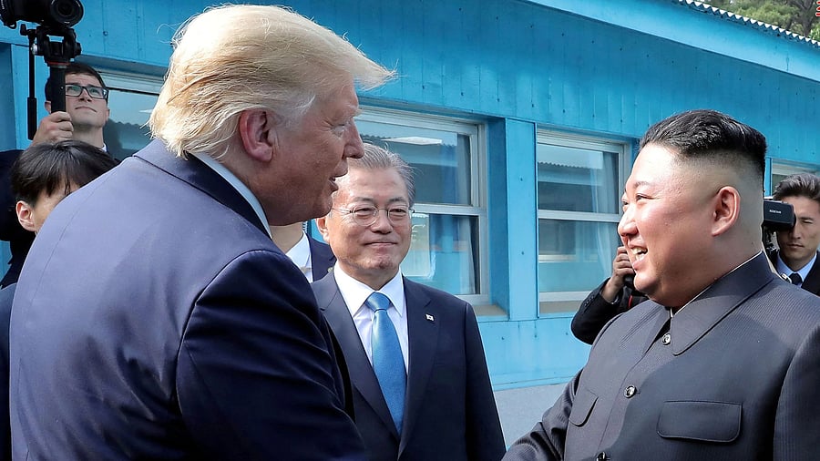 <div class="paragraphs"><p>US President Donald Trump shakes hands with North Korean leader Kim Jong Un</p></div>