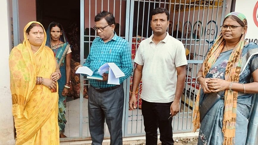 <div class="paragraphs"><p>Booth Level Officers assist voters in filling out enumeration forms as part of SIR in Bihar. </p></div>