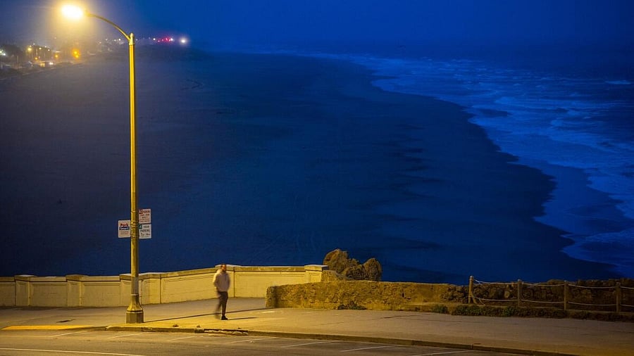 <div class="paragraphs"><p>A person walks along Ocean Beach, after authorities warned residents of the possibility of tsunami waves, following an earthquake at Russia's Kamchatka Peninsula, in San Francisco, California.</p></div>