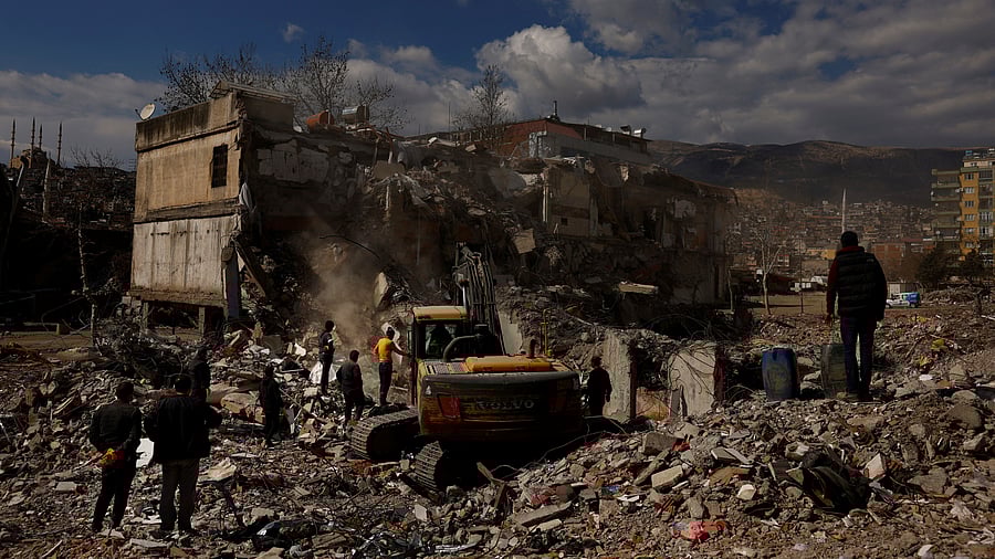 <div class="paragraphs"><p>People search through the rubble of a collapsed building, in the aftermath of a deadly earthquake, in Kahramanmaras, Turkey, March 9, 2023.</p></div>