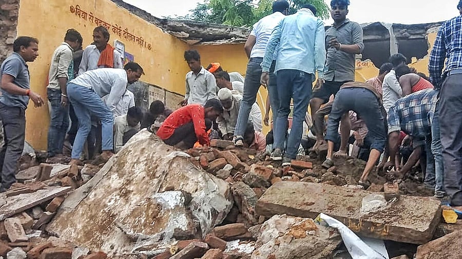 <div class="paragraphs"><p>Locals during the rescue work after a government school building collapsed, in Jhalawar district, Rajasthan, Friday, July 25, 2025.</p></div>