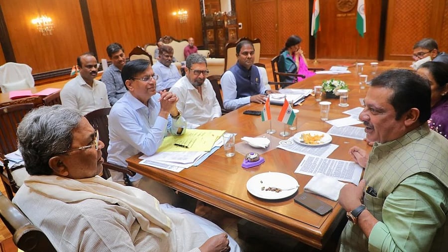 Chief Minister Siddaramaiah holds a meeting with Congress MLAs during a meeting in Bengaluru on Wednesday. Minister B Z Zameer Ahmed Khan is seen.