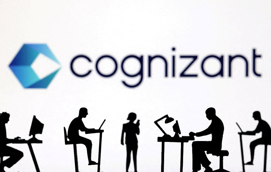 <div class="paragraphs"><p>Figurines with computers and smartphones are seen in front of Cognizant logo in this illustration taken.</p></div>