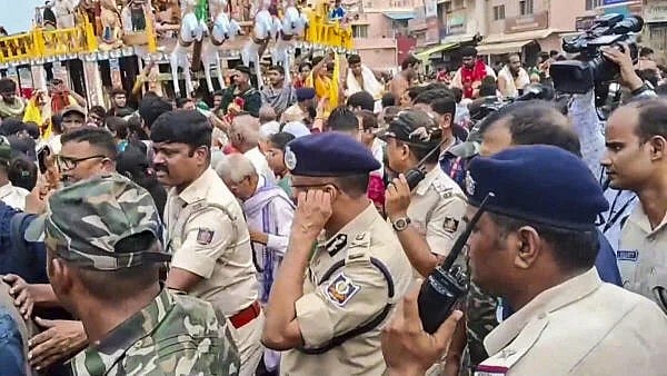 <div class="paragraphs"><p>Police officials visit the site after a stampede near Shree Gundicha Temple, in Puri, Odisha.</p></div>