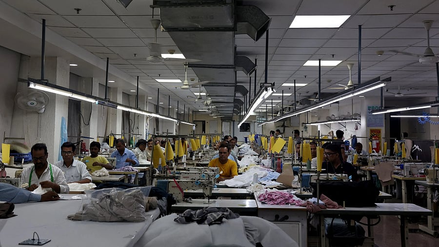 <div class="paragraphs"><p>Garment workers stitch clothes at a textile factory in Noida, India, July 31, 2025. </p></div>