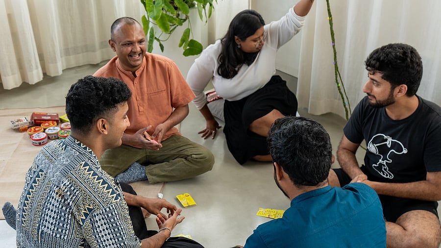 <div class="paragraphs"><p>At Analogue Club, held at a wellness space in Domlur, participants submit their&nbsp;phones in a basket and engage in activities like art and board games. </p></div>