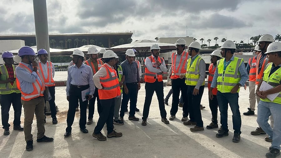 <div class="paragraphs"><p>BMRCL Managing Director J Ravishankar inspects the airport metro line works on Thursday. </p></div>