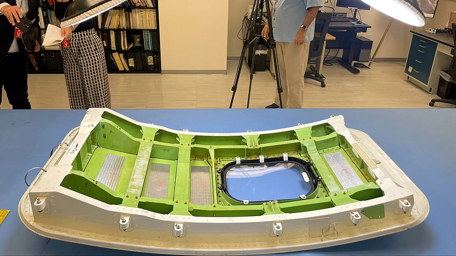 <div class="paragraphs"><p>Members of the news media view the Alaska Airlines Flight 1282 door plug in advance of National Transportation Safety Board hearings in early August on the January Alaska Airlines Boeing 737 MAX 9 in-flight door plug emergency, at the NTSB materials lab in Washington, US, July 30, 2024. </p></div>