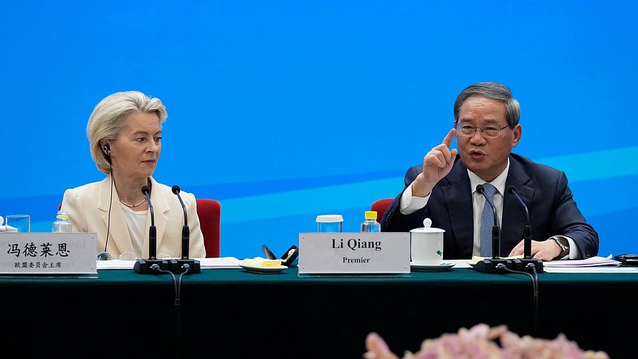 <div class="paragraphs"><p>Chinese Premier Li Qiang speaks as European Commission President Ursula von der Leyen looks on during the EU-China Business leaders symposium at the Great Hall of the People in Beijing, China, July 24, 2025. </p></div>