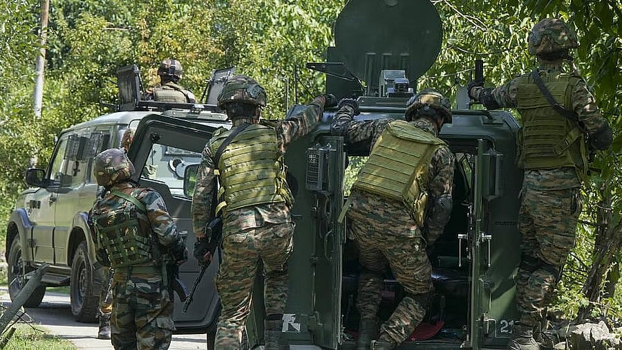 <div class="paragraphs"><p>Security personnel keep vigil after at least three unidentified terrorists were killed in an encounter, near Dachigam in Srinagar. </p></div>