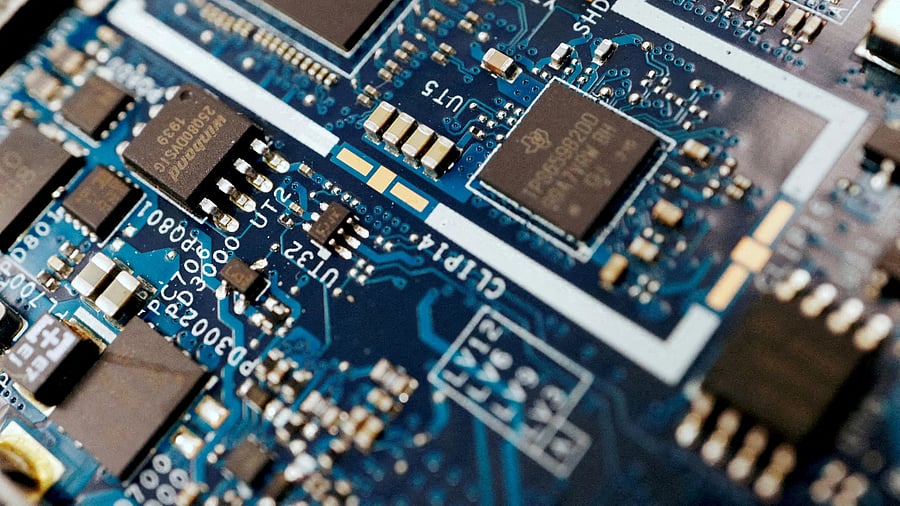<div class="paragraphs"><p>FILE PHOTO: Semiconductor chips are seen on a circuit board of a computer.</p></div>