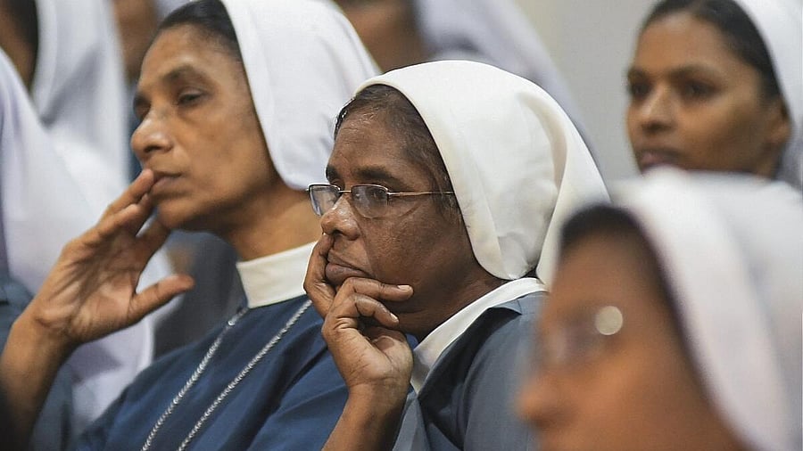 <div class="paragraphs"><p>Nuns watch an act, staged as part of a protest against the arrest of two Kerala nuns on allegations of forcible conversion and trafficking in Chhattisgarh, in Kozhikode, Kerala, Friday, Aug. 1, 2025.</p></div>