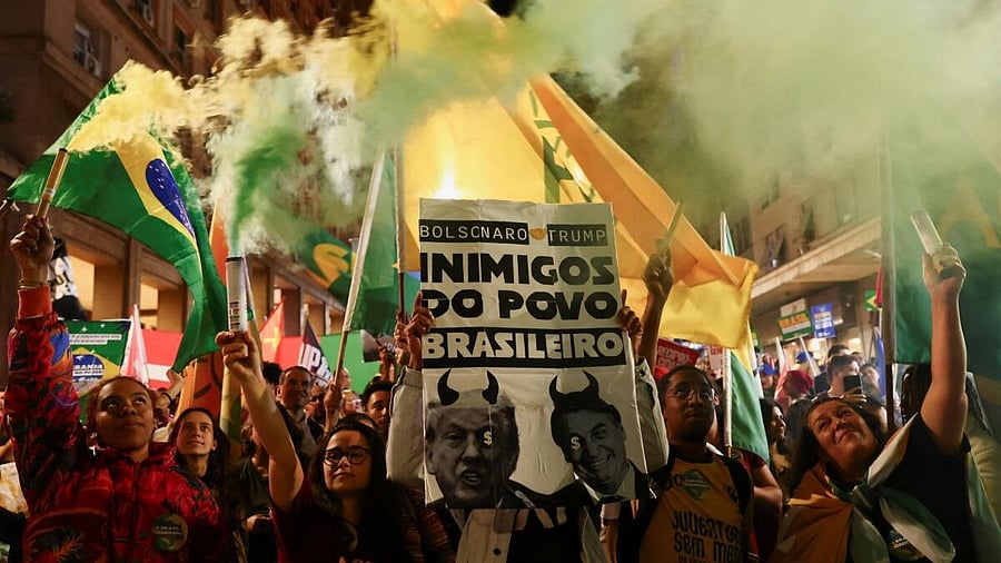 <div class="paragraphs"><p>Demonstrators hold placards and flags during a protest against tariffs on Brazilian goods imposed by U.S. President Donald Trump, in Porto Alegre, Brazil, August 1, 2025.</p></div>