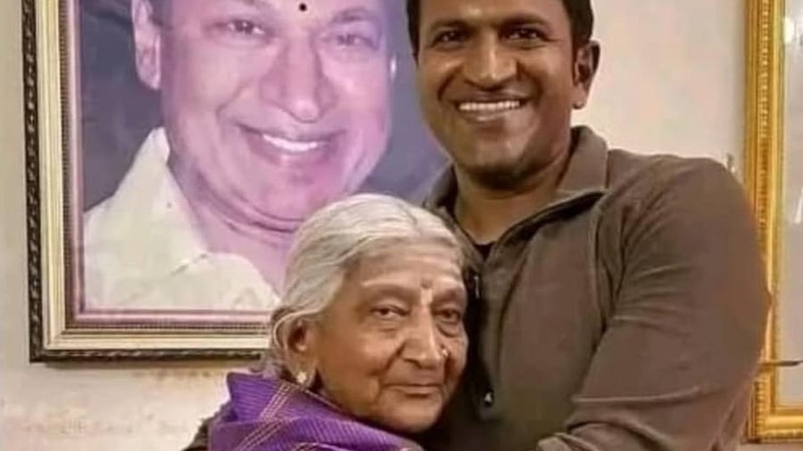 <div class="paragraphs"><p>Puneeth with Dr Rajkumar's sister Nagamma.</p></div>