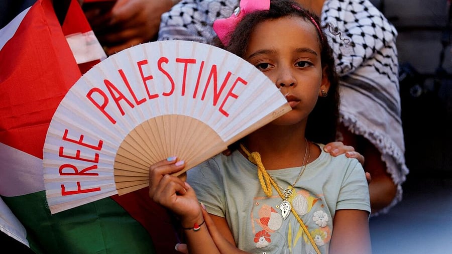 <div class="paragraphs"><p>A girl holds a hand fan reading 'Free Palestine' during an "Act NOW against Genocide in Gaza" protest, amid the ongoing conflict between Israel and Hamas, in Valletta, Malta, July 29, 2025.</p></div>