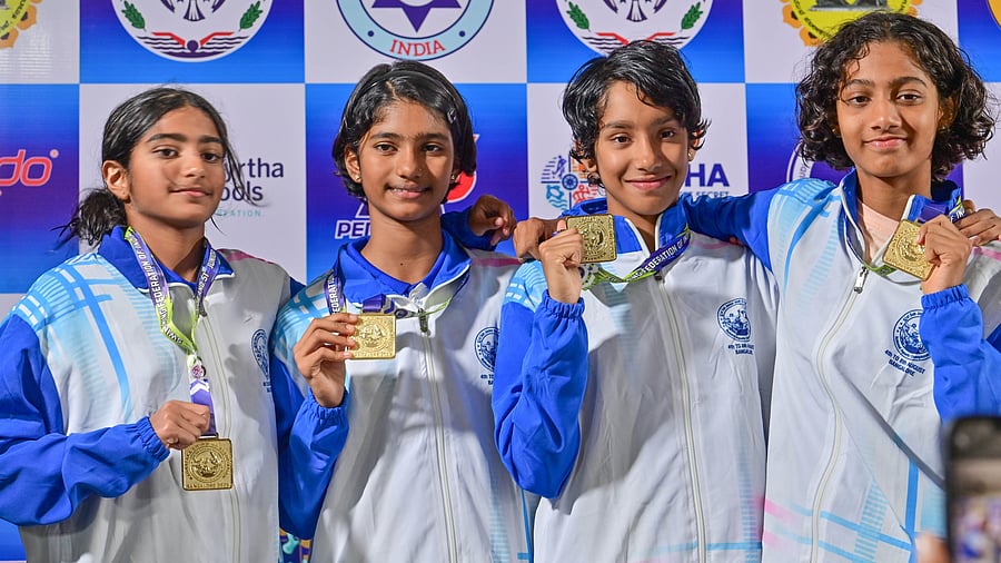 <div class="paragraphs"><p>LEFT: Karnataka’s (from left) Shwiti Diwakar Suvarana, Stuti Singh, Prapthi JP and Nyra Bopanna Kalengada pose after winning gold in the girls’ Group III 200m freestyle relay at the 41st Sub-Junior National Aquatics Championships in BAC on Monday. Karnataka’s Skandan Prasad in action at the diving competition in Kensington Swimming Pool. </p></div>